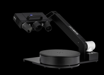 ZEISS Scanport 3D scanner with rotating platform for precision jewelry and small parts digitization on black background